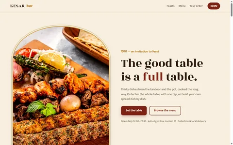 The KESAR homepage: a mixed grill in a gold arch frame beside &lsquo;The good table is a full table&rsquo;.