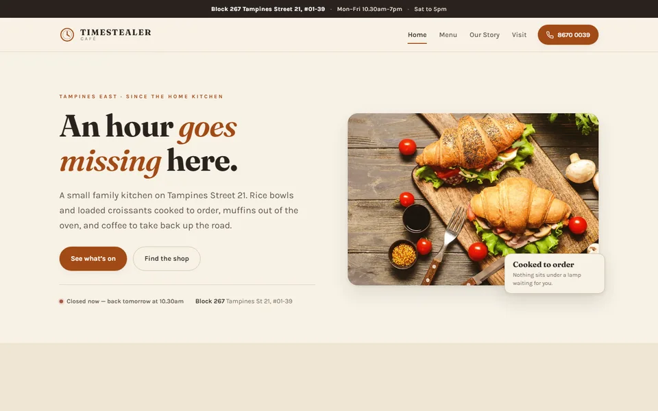 The Timestealer Caf&eacute; homepage: &lsquo;An hour goes missing here&rsquo; beside a board of filled croissants, over a warm parchment layout.