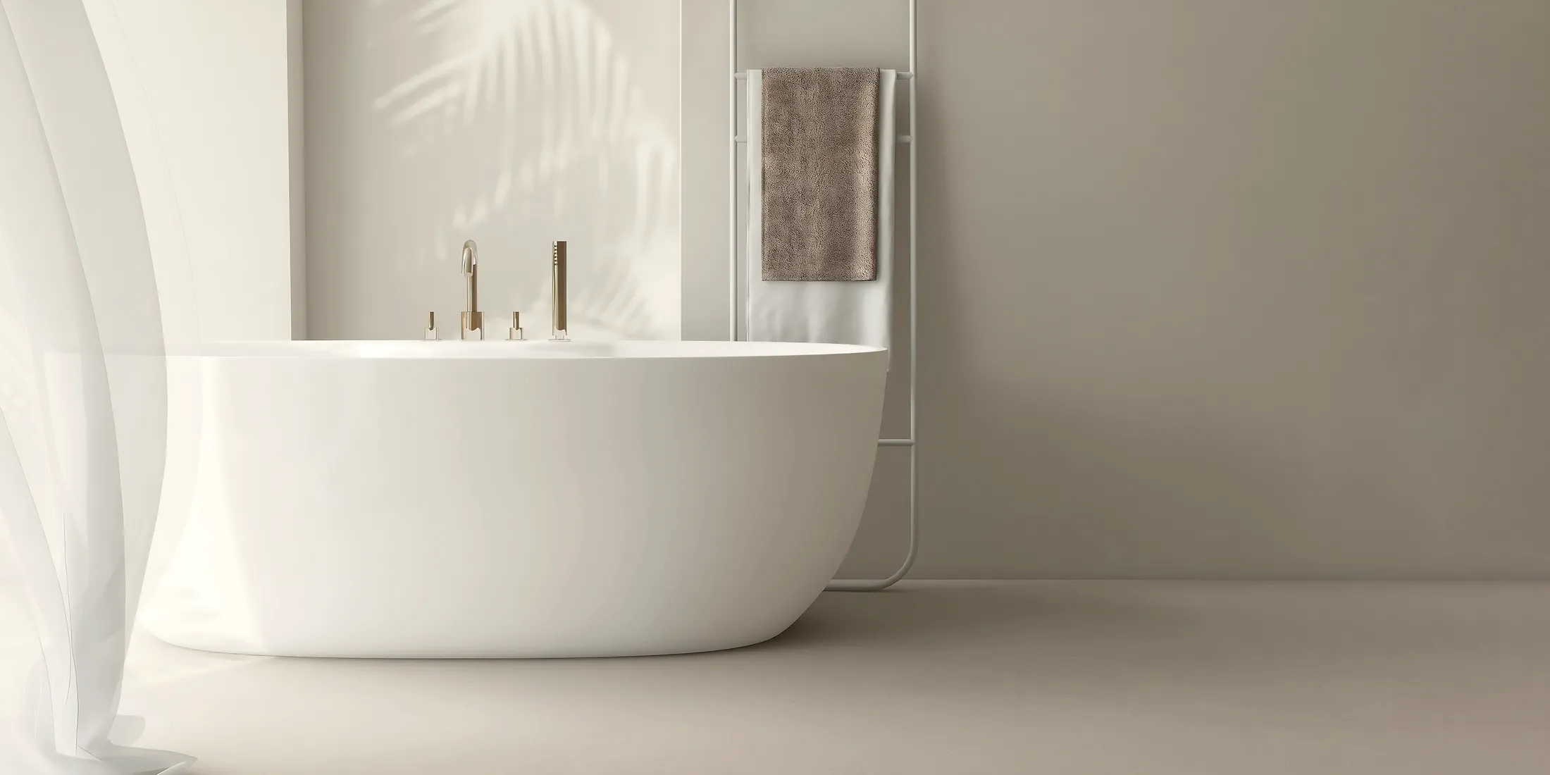 A white freestanding tub in a pale room, a sheer curtain moving in the light.