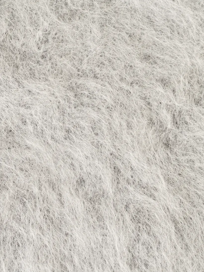 Brushed lambswool detail.