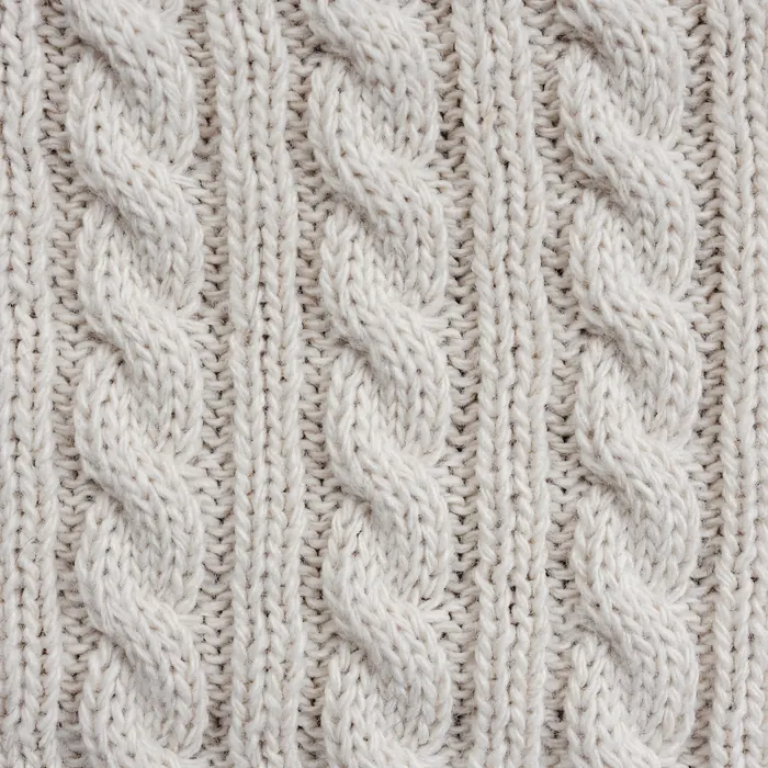 Macro of undyed lambswool yarn.