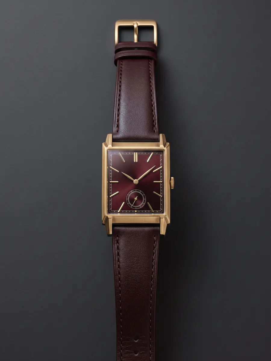 The Centenary 1926 Bordeaux: gilt case, burgundy dial, burgundy strap.