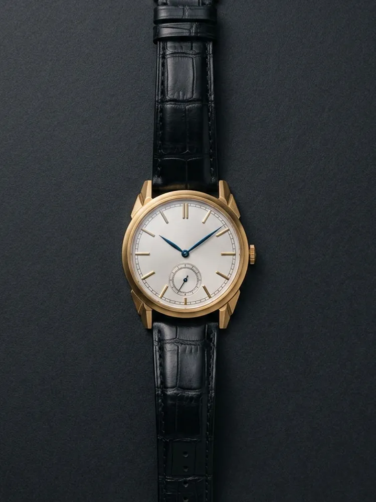 The Ronde 1931 Opaline: round gilt case, opaline silver dial, black alligator strap.